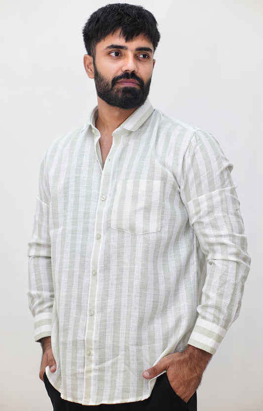 Man wearing a white striped shirt against a plain background